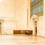 A man sitting inside Grand Central Terminal relaxing, New York City ny nyc.