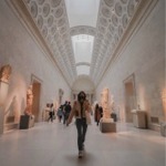 This photograph shows people in one of the Greek and Roman galleries at the Metropolitan Museum of Art in New York City.