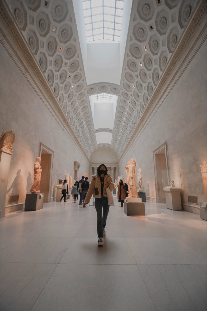 This photograph shows people in one of the Greek and Roman galleries at the Metropolitan Museum of Art in New York City.