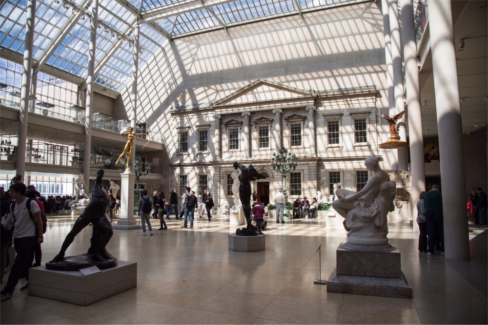 This photograph shows people in the American Wing at the Metropolitan Museum of Art in New York City.