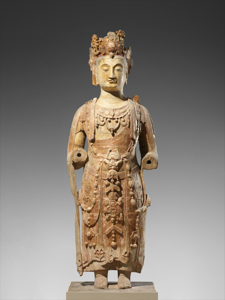 Photograph of a statue of Bodhisattva, probably Avalokiteshvara (Guanyin) ca. 550-560 in the Asian Wing at the Metropolitan Museum of Art in New York City.