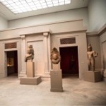 This photograph shows Cambodian statues in gallery 249 at the Metropolitan Museum of Art in New York City.