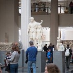 These photographs show a Statue of Dionysos leaning on a female figure (Hope Dionysos) housed in the Greek and Roman galleries at the Metropolitan Museum of Art in New York City.