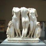 This photograph shows The Three Graces statue housed in gallery 162 at the Metropolitan Museum of Art in New York City.