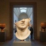 This photograph shows a fragment of a colossal marble head thought to be that of Alexander the Great at the Metropolitan Museum of Art in New York City.
