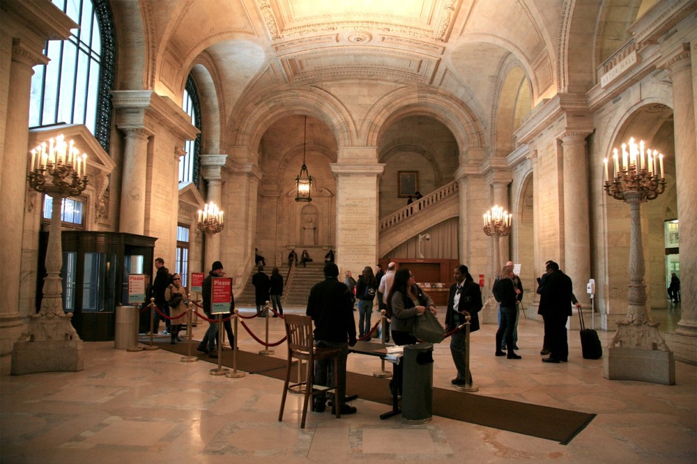 New York Public Library main branch's Astor Hall. The image also shows the elaborate Beaux-Arts features used in the library's design and construction.