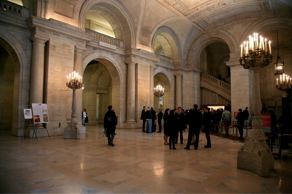 New York Public Library main branch's Astor Hall. The image also shows the elaborate Beaux-Arts features used in the library's design and construction.