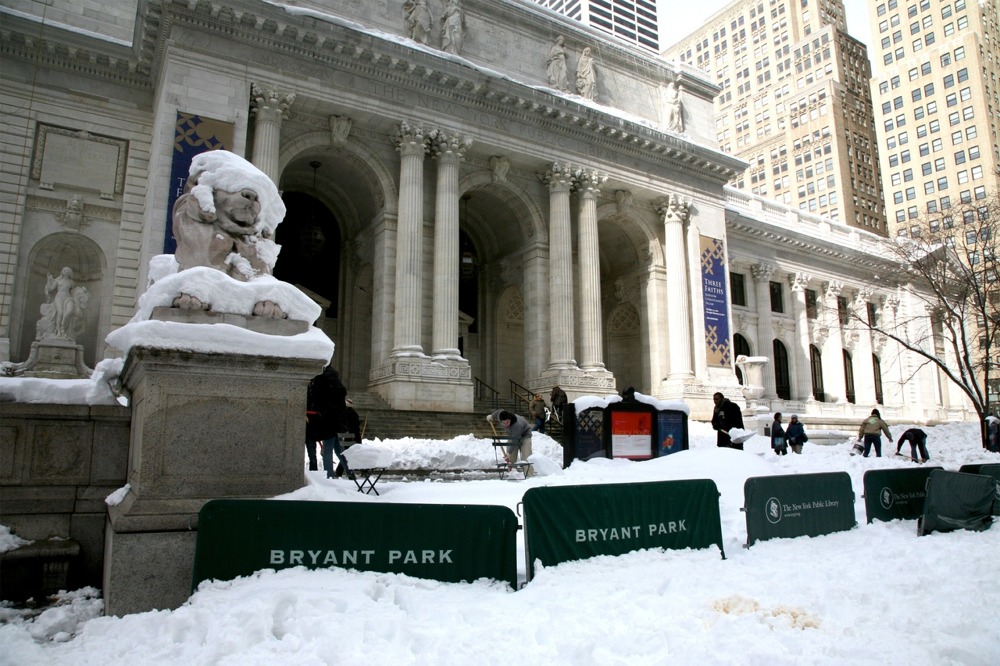 The New York Public Library main branch facade along Fifth Avenue between 40th and 42nd Streets in winter time.