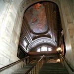 This photograph was taken on a staircase leading up to the McGraw Rotunda. The Mural on the ceiling depicts Prometheus.