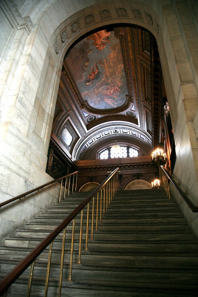 This photograph was taken on a staircase leading up to the McGraw Rotunda. The Mural on the ceiling depicts Prometheus.
